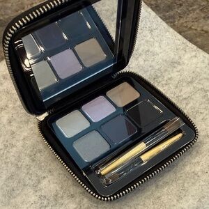 New never used. Compact Eyeshadow Palette with Brushes